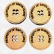 A pack of five 3cm round MDF Santa Buttons with deep engraving reading "Property of Santa Claus".