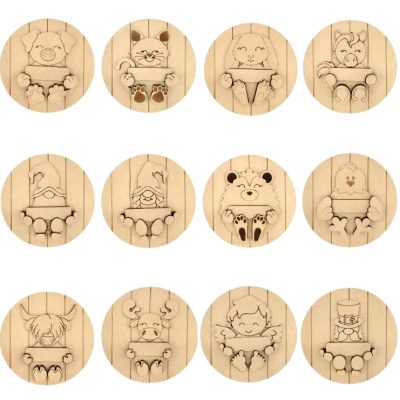 Twelve different unfinished 3D layered MDF animal plaques including a hedgehog, cat, and gnomes, each holding a blank sign.