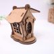 Detailed laser-cut 3D MDF open roof cottage house craft blank for DIY filling with sweets and painting.