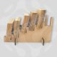 Tiered MDF coaster display stand holding wooden coasters for market stall organization.