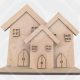 Set of three freestanding MDF houses on a base with separate windows and doors for DIY craft.