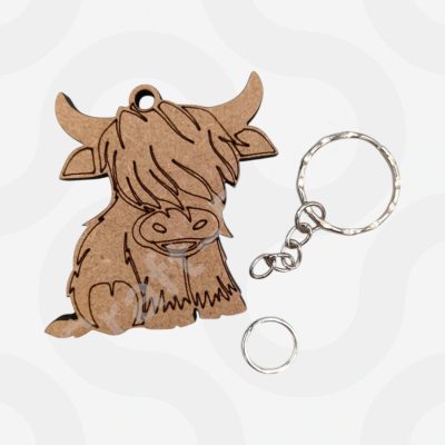 6cm chunky MDF Highland cow keyring craft blank with metal chain and etched lines for DIY painting.