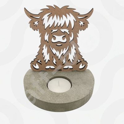 A Highland Cow Tealight Holder made from detailed 4mm laser-cut MDF, featuring a sturdy 18mm base with a 4.2cm hole for an LED tealight.
