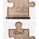 A freestanding laser-cut 4mm MDF Freestanding Framed Jigsaw Plaque with "Mum" or "Dad" text and interlocking mini puzzle pieces on a sturdy base.