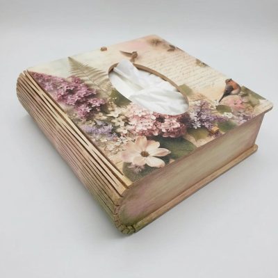 The Book Shaped Tissue Box Holder in 4mm MDF, highlighting its novelty curved living hinge spine while holding a standard tissue box.