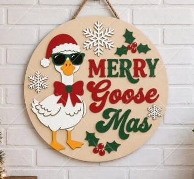 Finished Merry Goosemas Door Hanger displaying a 20cm layered wooden plaque with a painted goose in a Santa hat, bow tie, and sunglasses next to "Merry Goose-Mas" lettering.